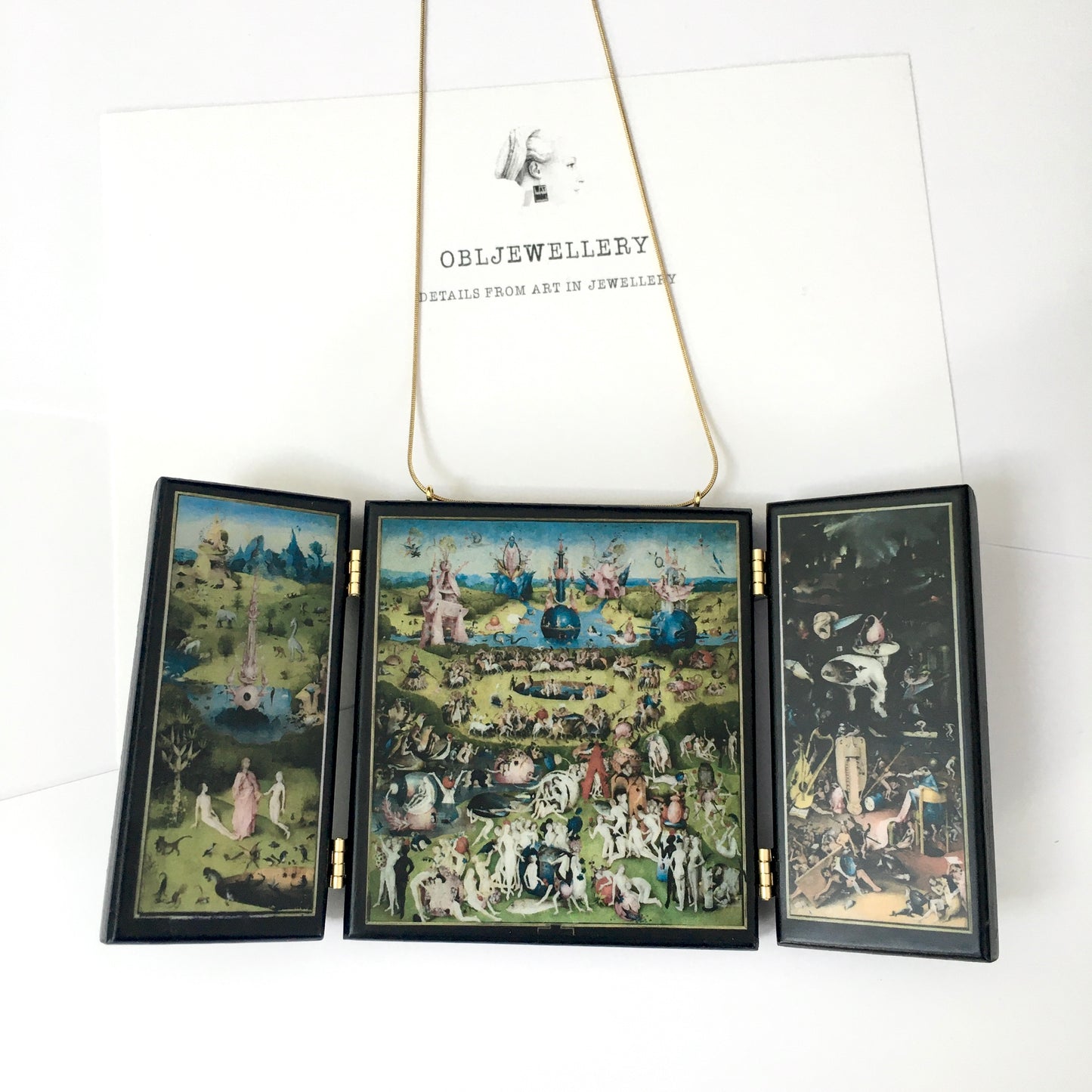 A fully functioning, reproduction in miniature of the three panelled masterpiece, Garden of Earthly Delights by Hieronymus Bosch, turned into a beguiling necklace.