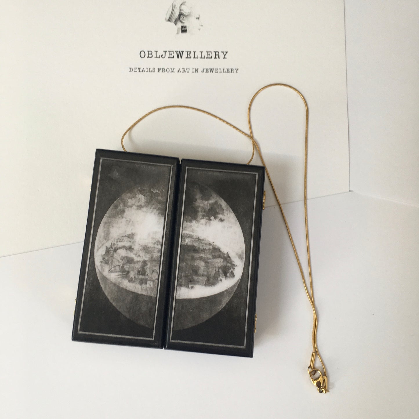 Grisalla paneles. A fully functioning, reproduction in miniature of the three panelled masterpiece, Garden of Earthly Delights by Hieronymus Bosch, turned into a beguiling necklace.