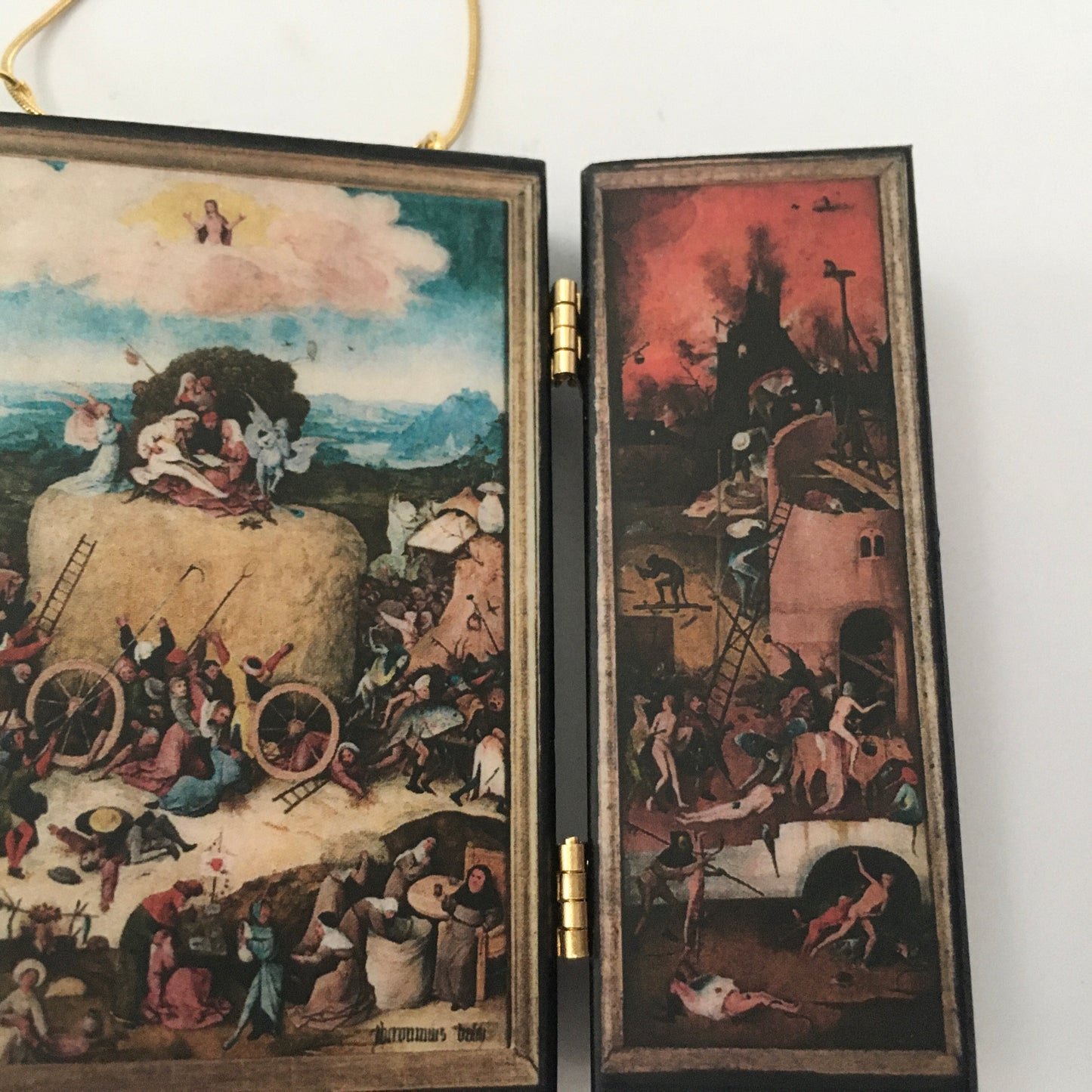 Triptych miniature art necklace handmade from sustainable wood reproduce The Haywain painting by Hieronymus Bosch. This aesthetic fully functioning art pendant necklace is created and designed by Obljewellery