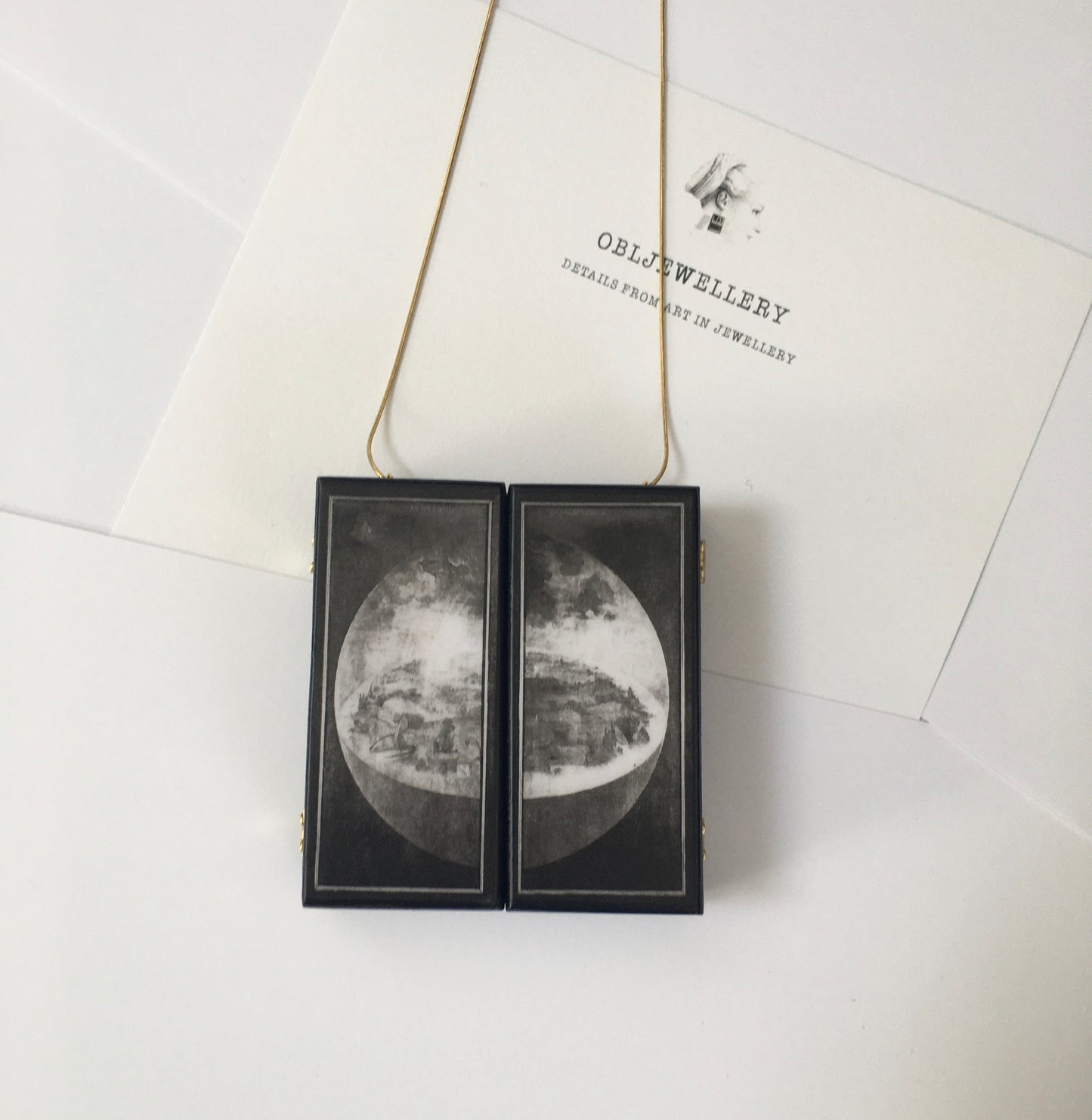grisalle art. A fully functioning, reproduction in miniature of the three panelled masterpiece, Garden of Earthly Delights by Hieronymus Bosch, turned into a beguiling necklace.