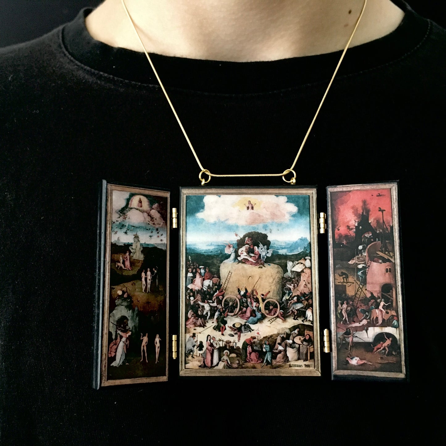 Triptych miniature art necklace handmade from sustainable wood reproduce The Haywain painting by Hieronymus Bosch. This aesthetic fully functioning art pendant necklace is created and designed by Obljewellery