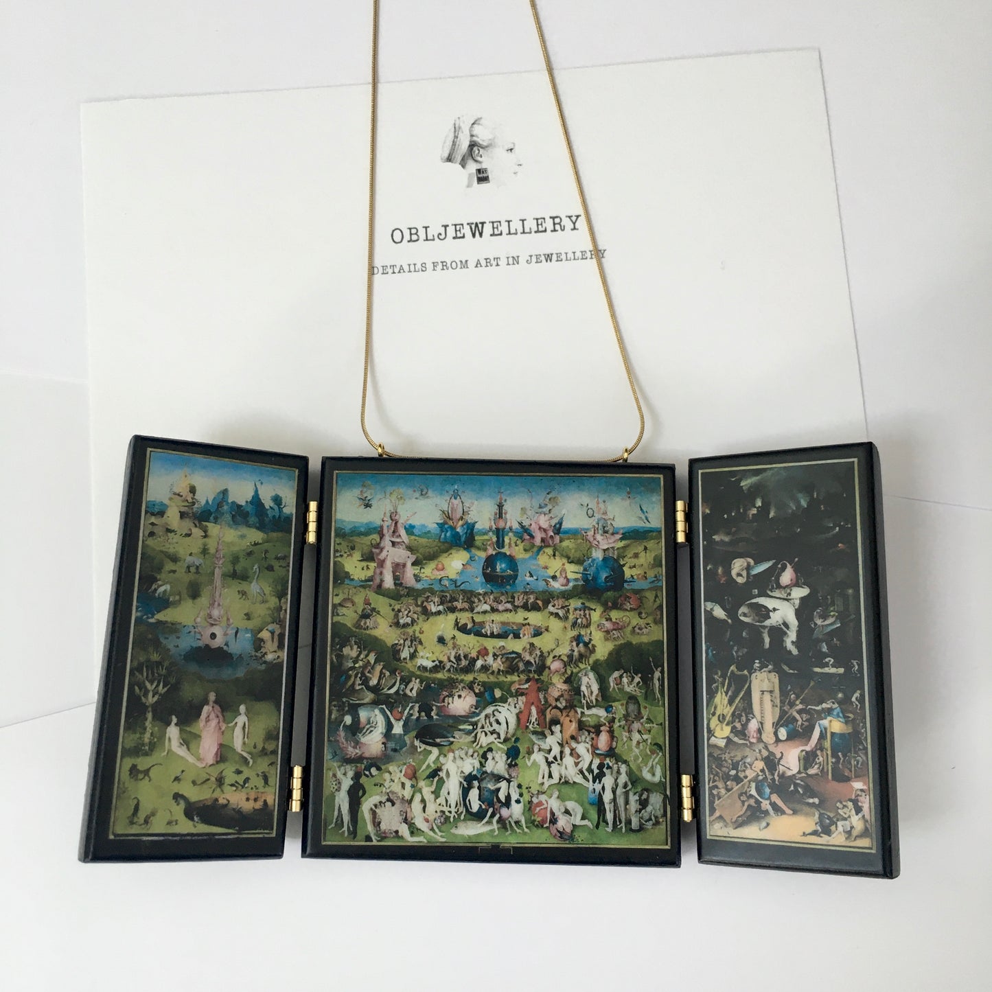 A fully functioning, reproduction in miniature of the three panelled masterpiece, Garden of Earthly Delights by Hieronymus Bosch, turned into a beguiling necklace.