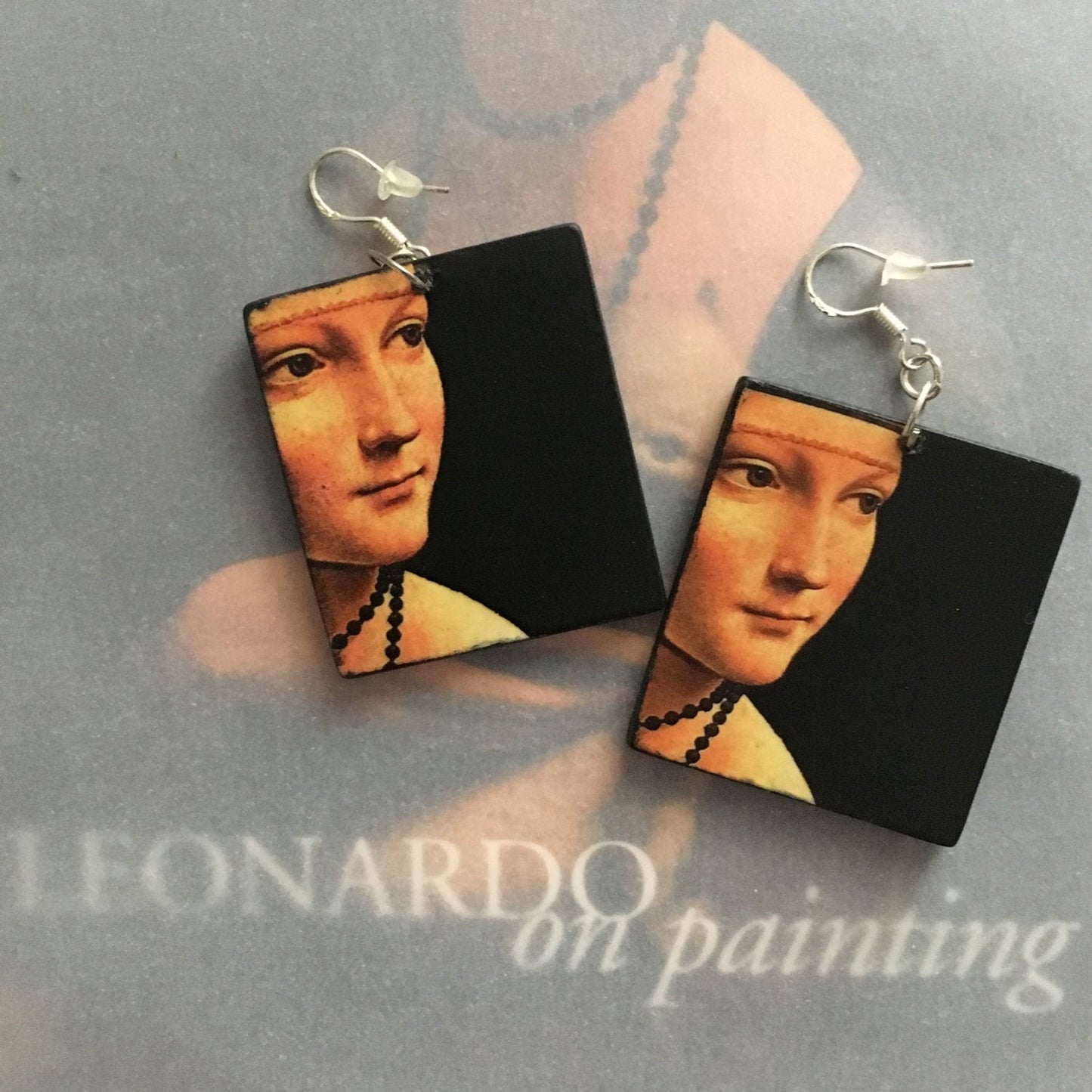 Italian Renaissance artist Leonardo da Vinci and his famous painting "La dama con l'ermellino" inspired Obljewellery to handmade these art wooden earring with sterling silver hooks .