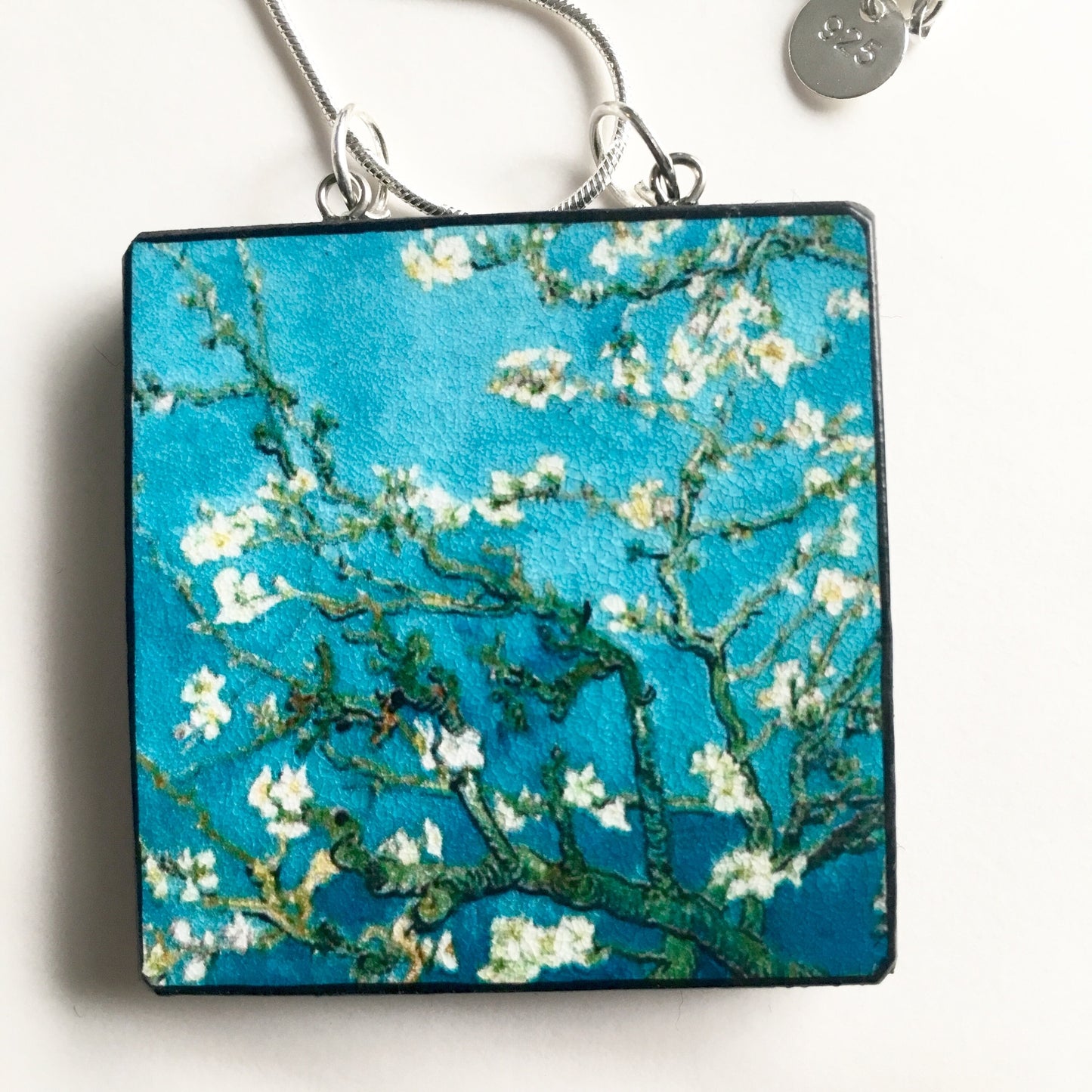The Van Gogh necklaces is inspired by the masterpiece "Almond Blossom" where the artist painted one of his favourite subjects large flowering branches against a blue sky. The almond tree blooms is a symbol of new life, this painting was a gift for his brother Theo and his wife who had a son. Vincent Van Gogh was inspired by Japanese prints. Vincent van Gogh (1853 - 1890), Saint-Rémy-de-Provence, February 1890 oil on canvas, 73.3 cm x 92.4 cm