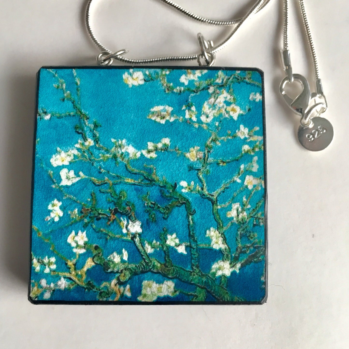 The Van Gogh necklaces is inspired by the masterpiece "Almond Blossom" where the artist painted one of his favourite subjects large flowering branches against a blue sky. The almond tree blooms is a symbol of new life, this painting was a gift for his brother Theo and his wife who had a son. Vincent Van Gogh was inspired by Japanese prints. Vincent van Gogh (1853 - 1890), Saint-Rémy-de-Provence, February 1890 oil on canvas, 73.3 cm x 92.4 cm