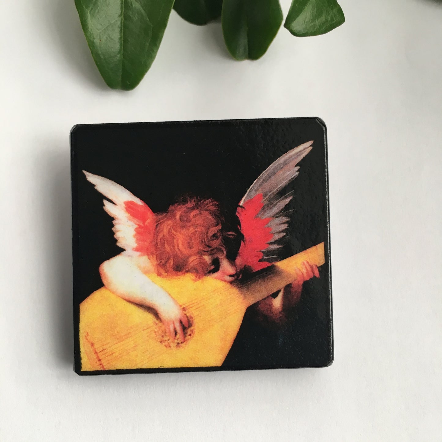 Wooden square brooch pin jewellery with an oil painting image by the Renaissance Italian artist Rosso Fiorentino. Dimensions approx. 4.3cm each side and c. 4mm in depth. Finished with Pin back, silver-plated steel, 4 cm with locking bar lead and nickel free, the brooch is backed with black velvet.