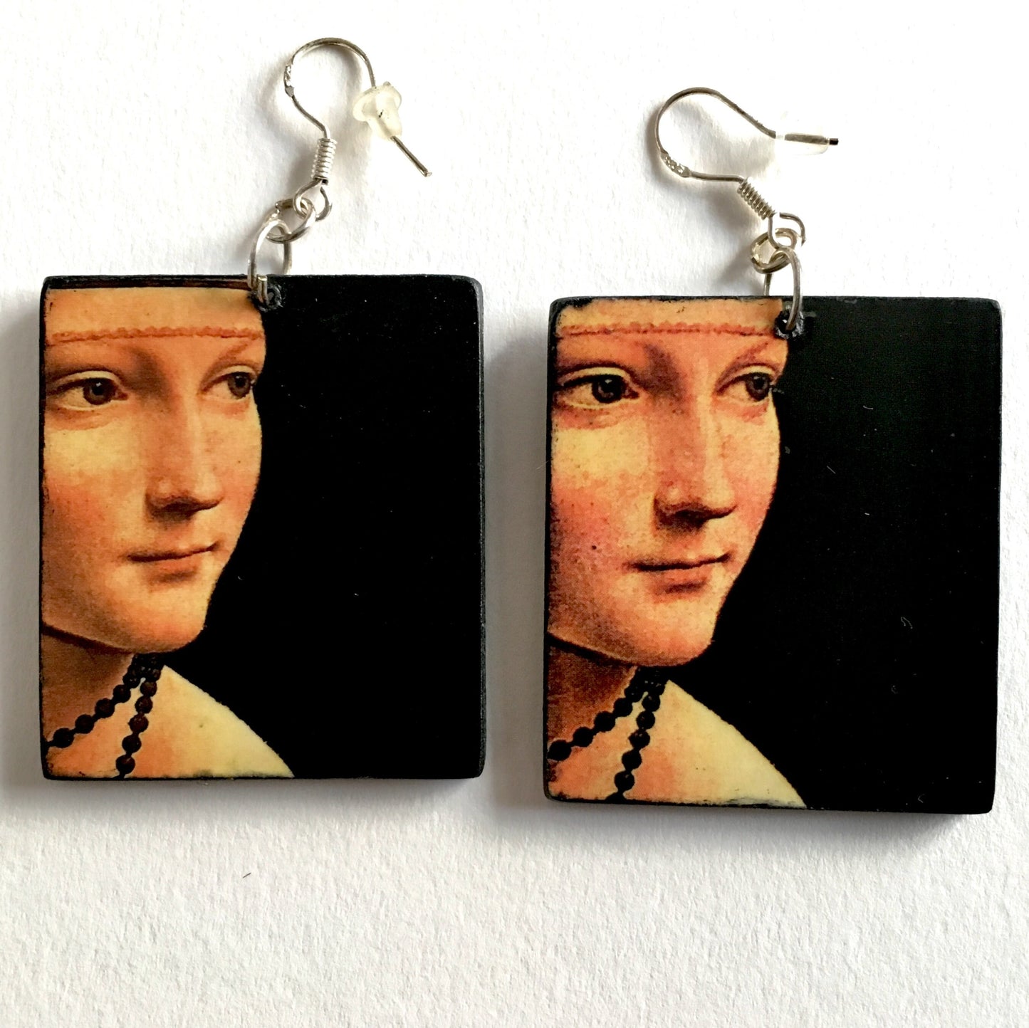 Italian Renaissance artist Leonardo da Vinci and his famous painting "La dama con l'ermellino" inspired Obljewellery to handmade these art wooden earring with sterling silver hooks .