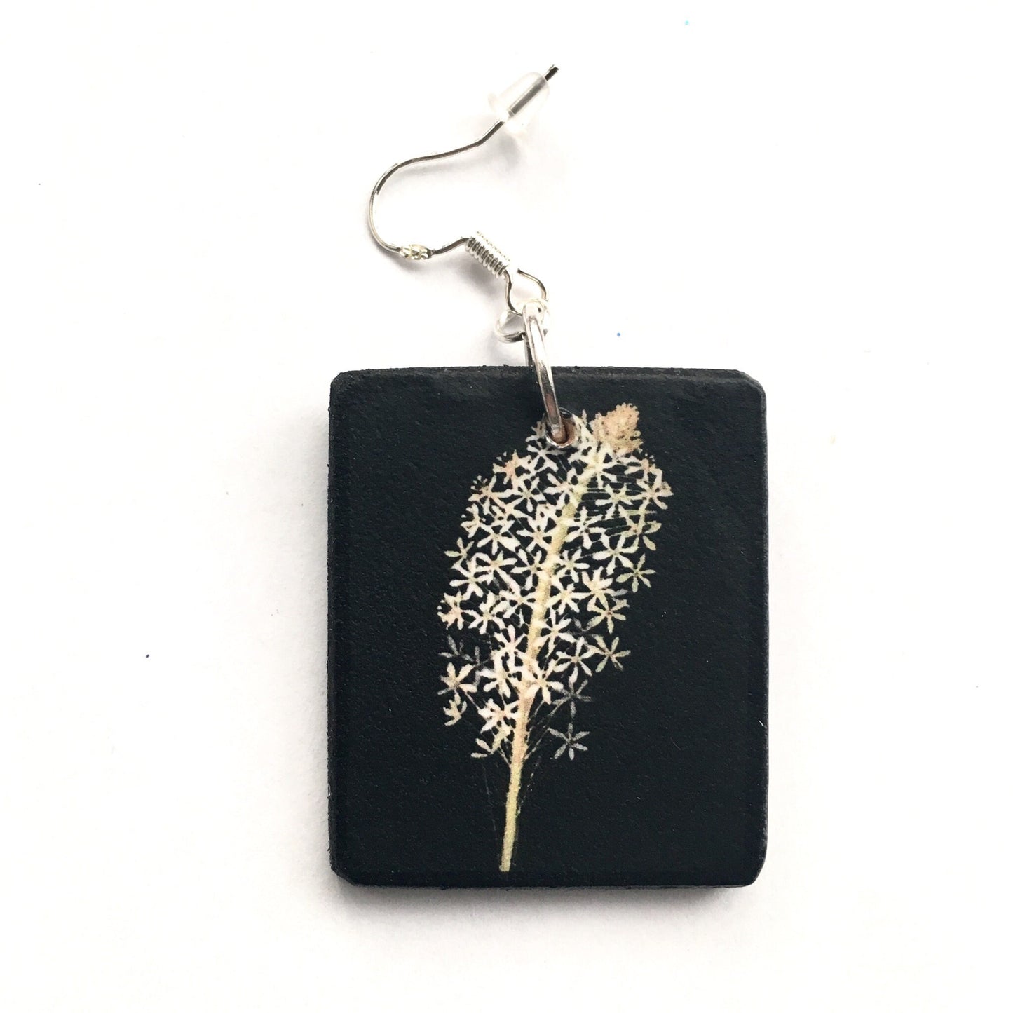 Obljewellery sustainable art earrings. These aesthetic earrings are on wood in black and white flowers a botanical artwork by Mary Delany. The earings are an artsy gift for her.