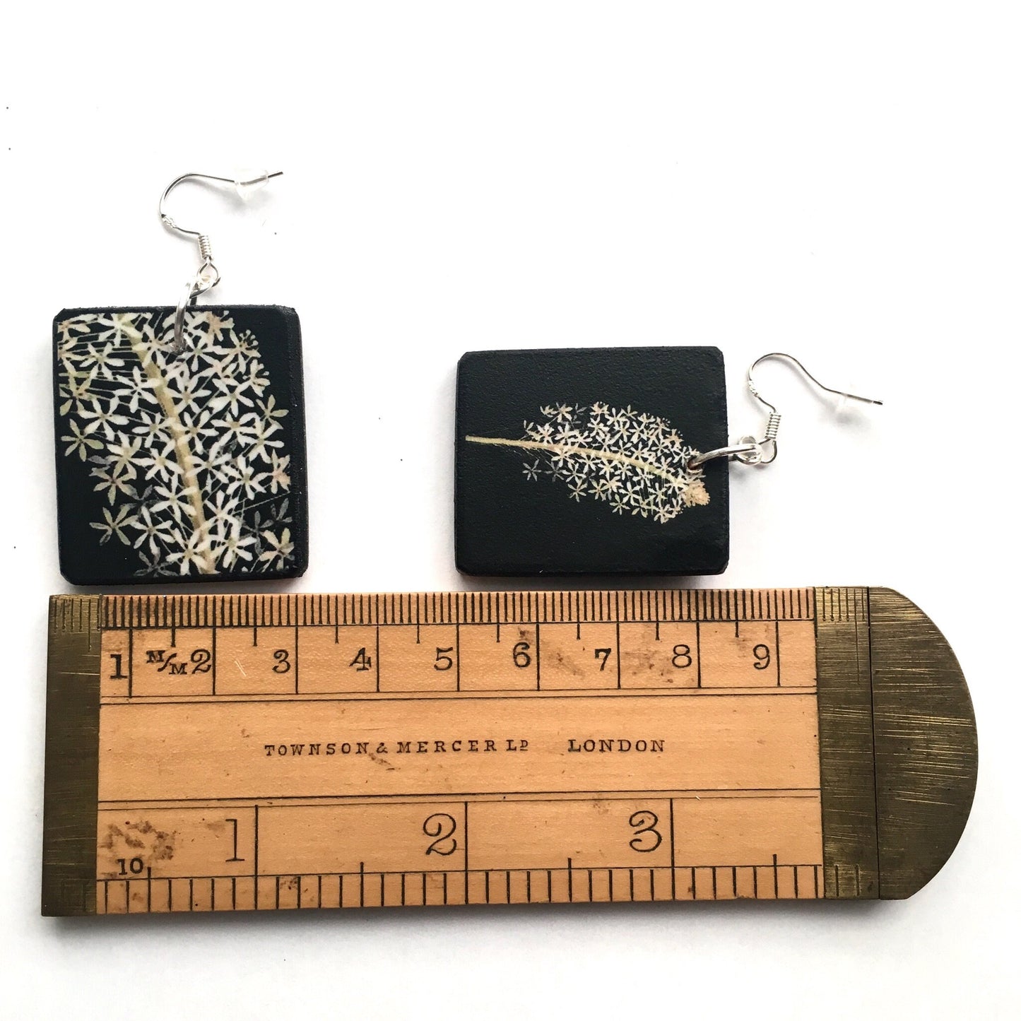 Obljewellery sustainable art earrings. These aesthetic earrings are on wood in black and white flowers a botanical artwork by Mary Delany. The earings are an artsy gift for her.