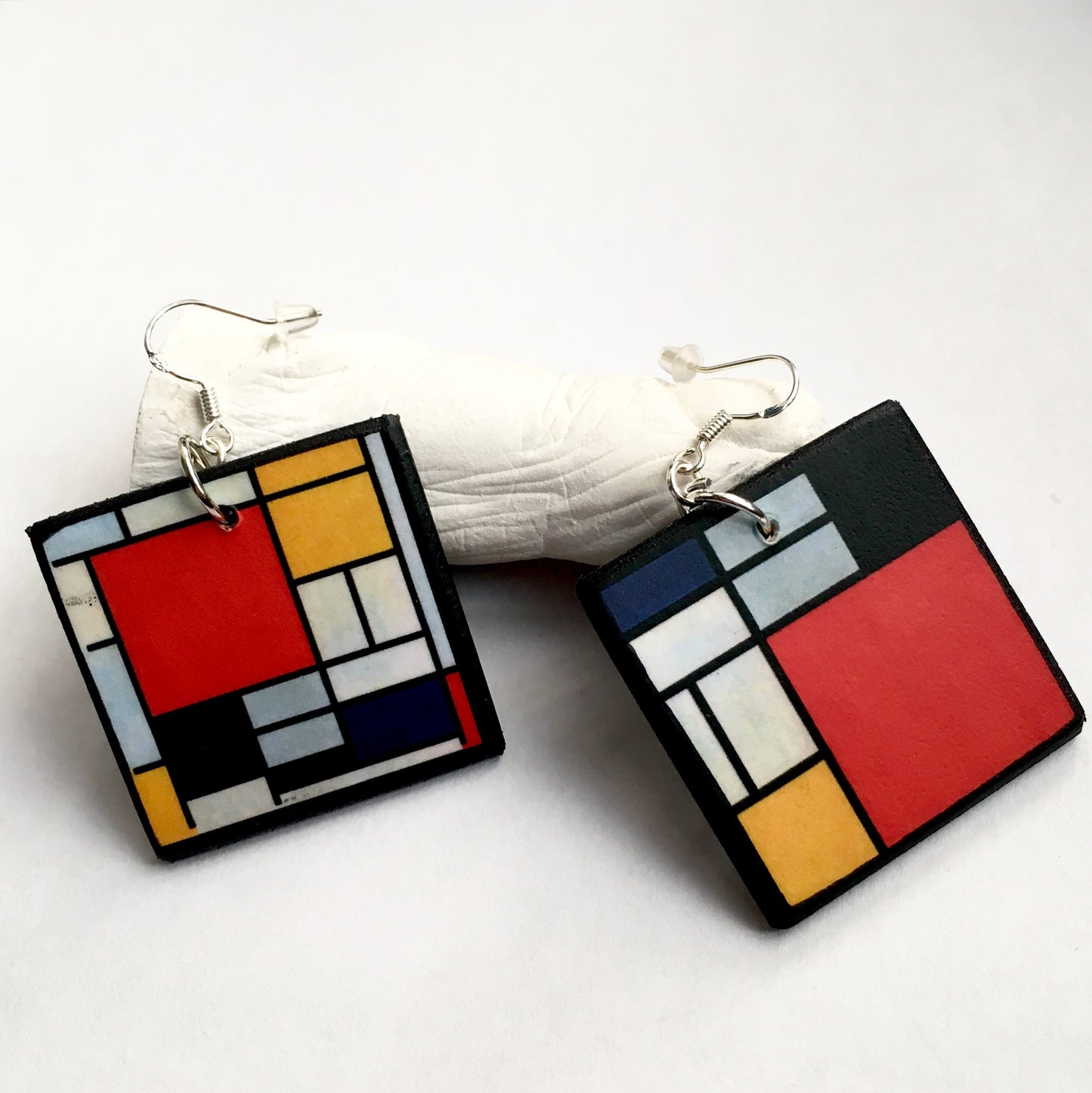 Mismatched earrings inspired by Mondrian.