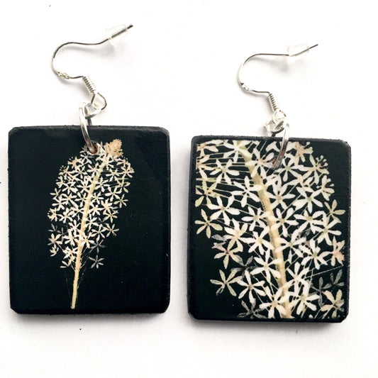 Obljewellery sustainable art earrings. These aesthetic earrings are on wood in black and white flowers a botanical artwork by Mary Delany. The earings are an artsy gift for her.
