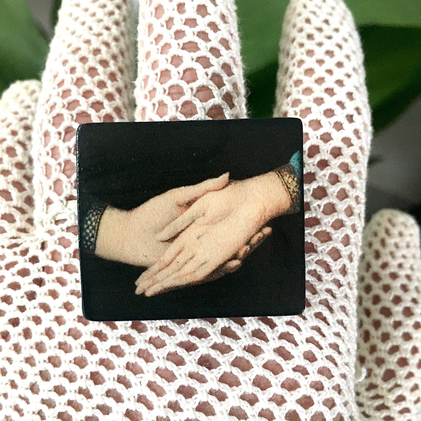Sustainable statement earrings on wood with an art detail of the Andolfini hands. Renaissance painting “Arnolfini Portrait” by Jan van Eyck. Obljewellery art jewellery shop.