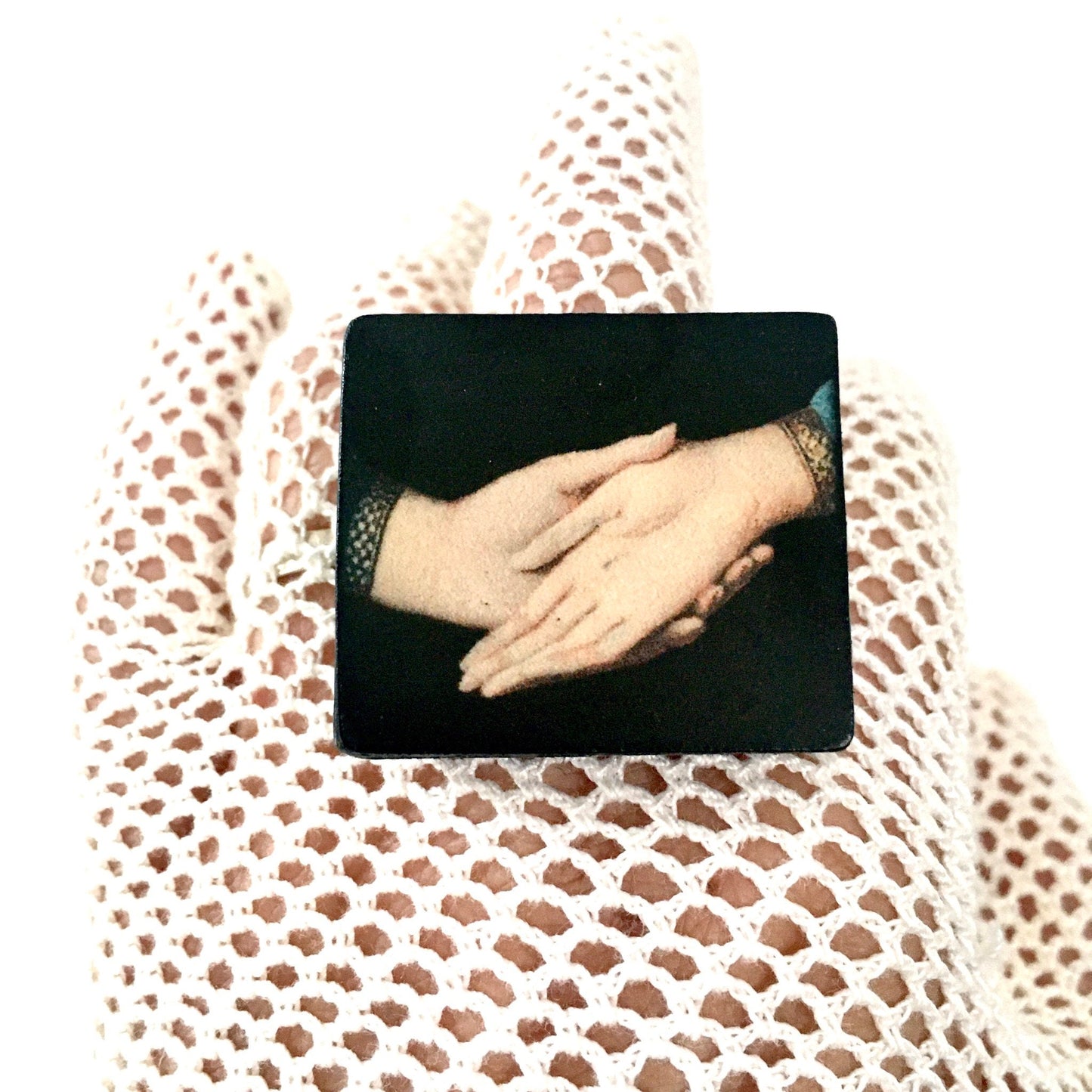 Sustainable statement earrings on wood with an art detail of the Andolfini hands. Renaissance painting “Arnolfini Portrait” by Jan van Eyck. Obljewellery art jewellery shop.