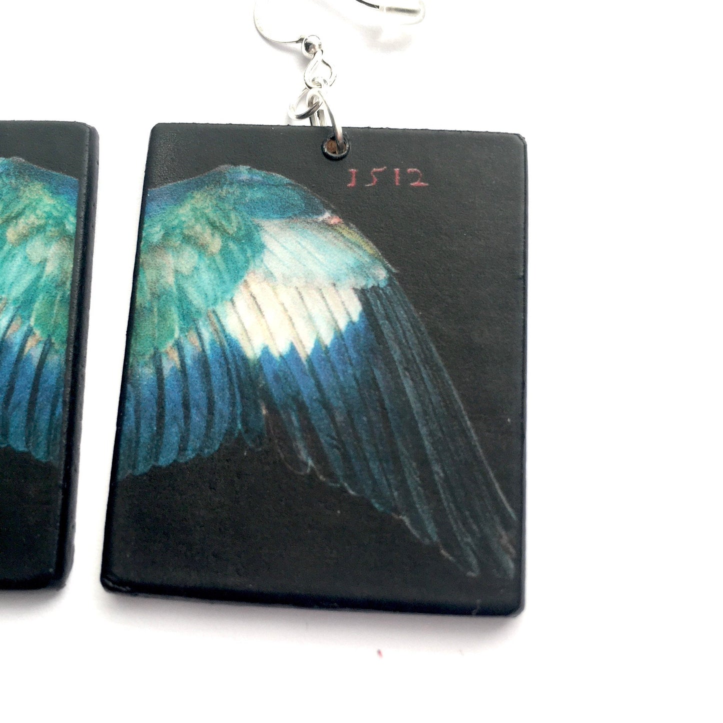 mismatched,statement art earrings inspired by German Renaissance artist Albrecht Durer. Sustainable wood earrings by Obljewellery