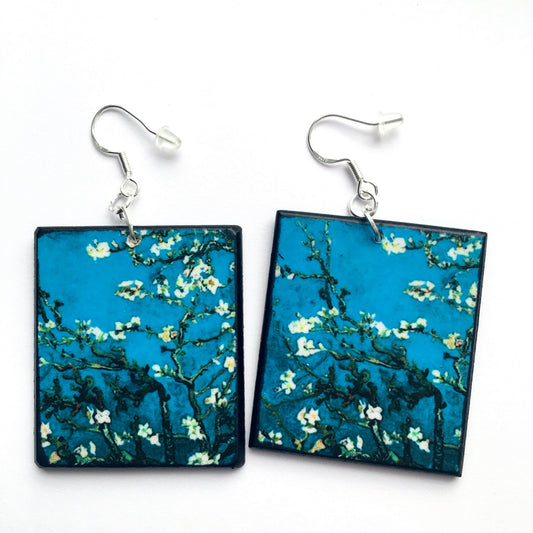 Sustainable wood earrings 4cm x 3.5 cm x 2/3 mm approx. Sterling silver 925 hooks. The Van Gogh artsy earrings are inspired by the masterpiece "Almond Blossom" where the artist painted one of his favourite subjects large flowering branches against a blue sky. The almond tree blooms is a symbol of new life, this painting was a gift for his brother Theo and his wife who had a son. Vincent Van Gogh was inspired by Japanese prints.