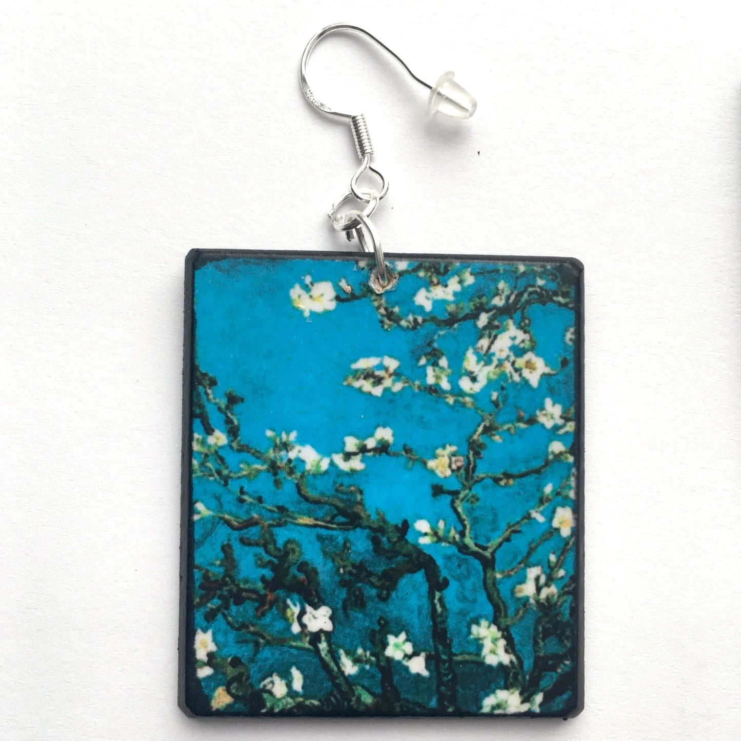 Sustainable wood earrings 4cm x 3.5 cm x 2/3 mm approx. Sterling silver 925 hooks. The Van Gogh artsy earrings are inspired by the masterpiece "Almond Blossom" where the artist painted one of his favourite subjects large flowering branches against a blue sky. The almond tree blooms is a symbol of new life, this painting was a gift for his brother Theo and his wife who had a son. Vincent Van Gogh was inspired by Japanese prints.