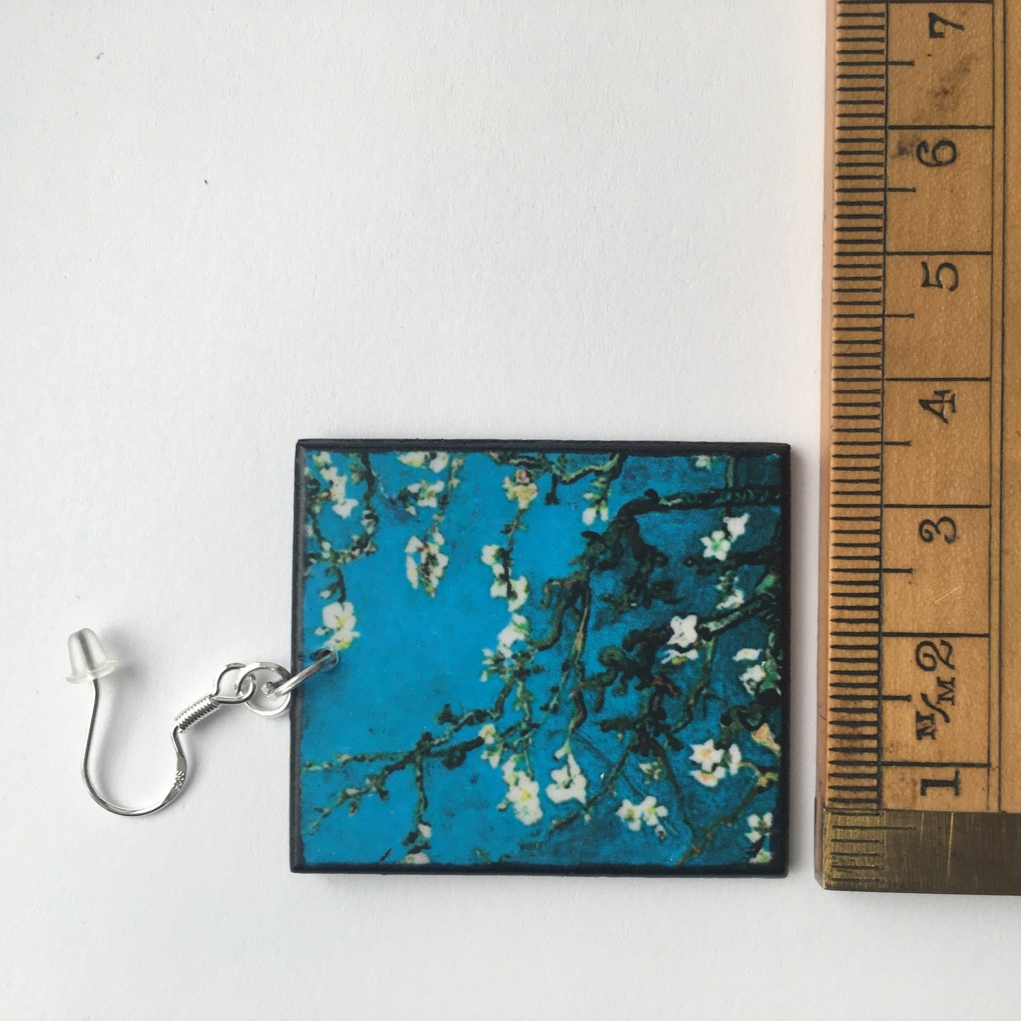 Sustainable wood earrings 4cm x 3.5 cm x 2/3 mm approx. Sterling silver 925 hooks. The Van Gogh artsy earrings are inspired by the masterpiece "Almond Blossom" where the artist painted one of his favourite subjects large flowering branches against a blue sky. The almond tree blooms is a symbol of new life, this painting was a gift for his brother Theo and his wife who had a son. Vincent Van Gogh was inspired by Japanese prints.