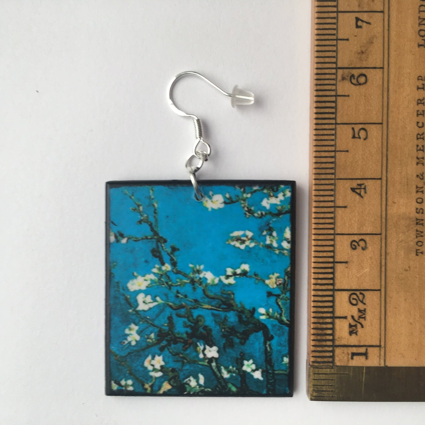 Sustainable wood earrings 4cm x 3.5 cm x 2/3 mm approx. Sterling silver 925 hooks. The Van Gogh artsy earrings are inspired by the masterpiece "Almond Blossom" where the artist painted one of his favourite subjects large flowering branches against a blue sky. The almond tree blooms is a symbol of new life, this painting was a gift for his brother Theo and his wife who had a son. Vincent Van Gogh was inspired by Japanese prints.
