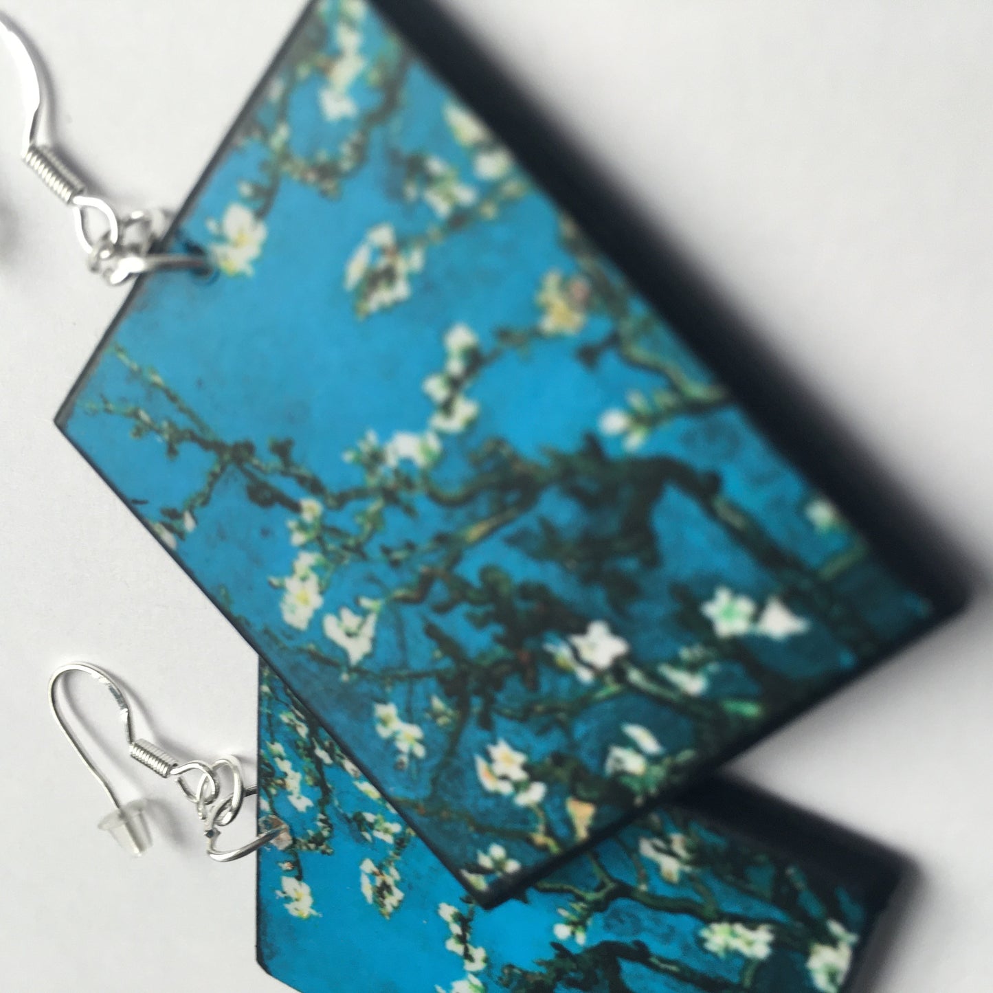 Sustainable wood earrings 4cm x 3.5 cm x 2/3 mm approx. Sterling silver 925 hooks. The Van Gogh artsy earrings are inspired by the masterpiece "Almond Blossom" where the artist painted one of his favourite subjects large flowering branches against a blue sky. The almond tree blooms is a symbol of new life, this painting was a gift for his brother Theo and his wife who had a son. Vincent Van Gogh was inspired by Japanese prints.