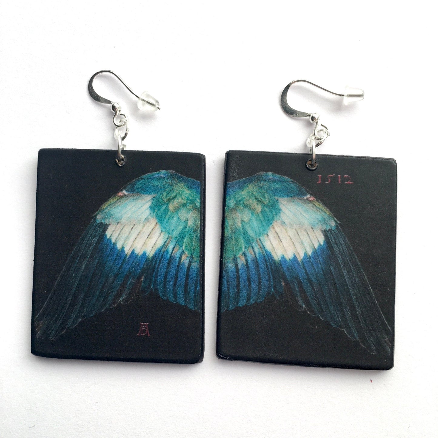mismatched,statement art earrings inspired by German Renaissance artist Albrecht Durer. Sustainable wood earrings by Obljewellery
