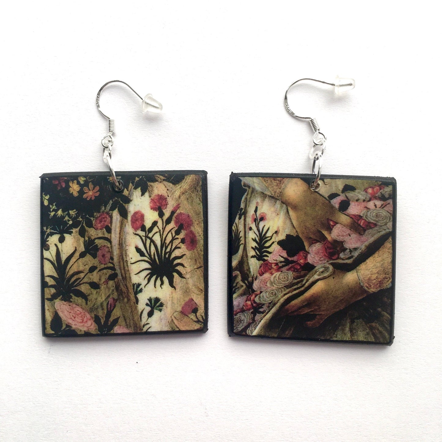 Sandro Botticelli missmatched earrings on square wood with a detail of the floreal dress in pink and white. Obljewellery inspired by Renaissance famous paintig The Spring.