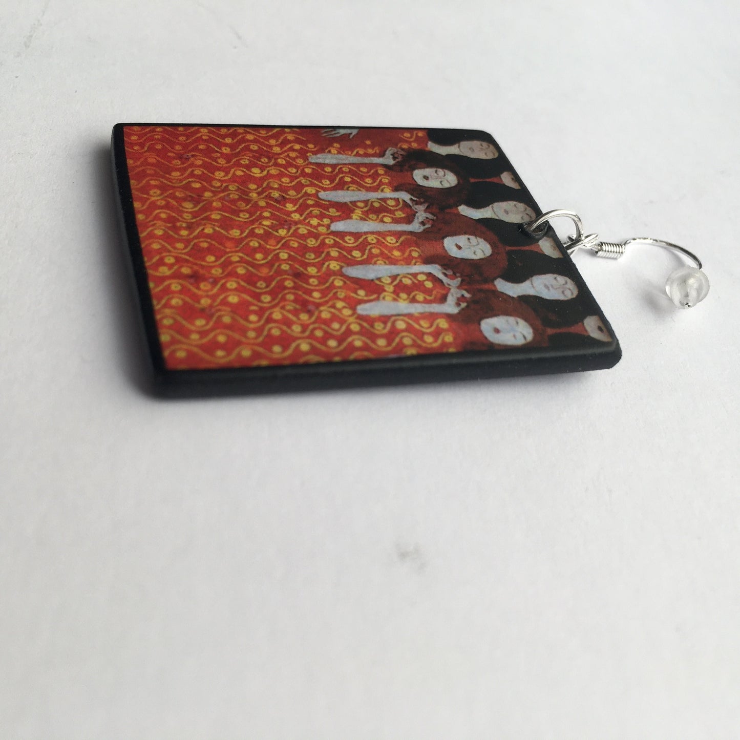 Aesthetic handmade earrings on wood inspired by painting "Beethoven Frieze" which was based on Wagner's interpretation of Beethoven's Ninth Symphony. Obljewellery artsy gift shop. The sustainable wood and sterling silver hook earrings are an alternative art gift for woman.