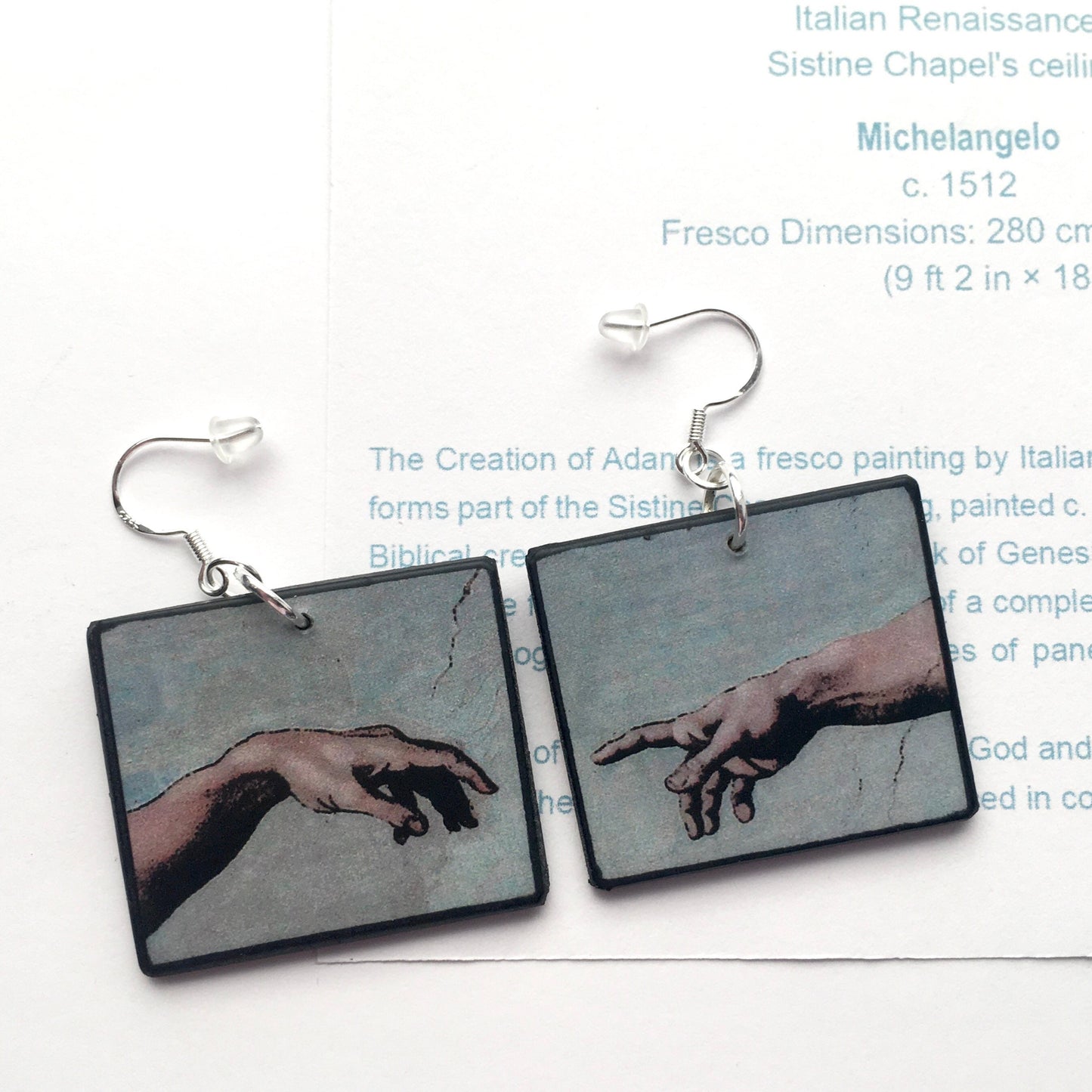 These earrings echo the famous scene of the Creation of Adam, frescoed in the Sistine Chapel by Michelangelo Buonarroti; Italian Renaissance artist. Handmade by Obljewellery from sustainable wood with sterling silver hooks.