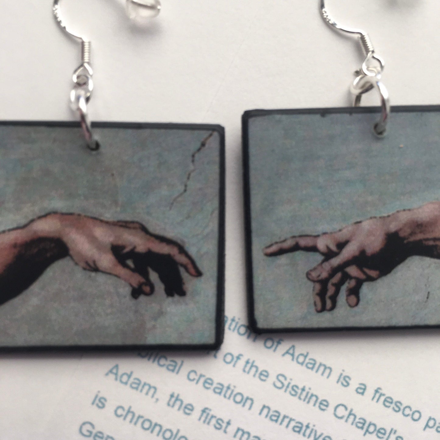These earrings echo the famous scene of the Creation of Adam, frescoed in the Sistine Chapel by Michelangelo Buonarroti; Italian Renaissance artist. Handmade by Obljewellery from sustainable wood with sterling silver hooks.