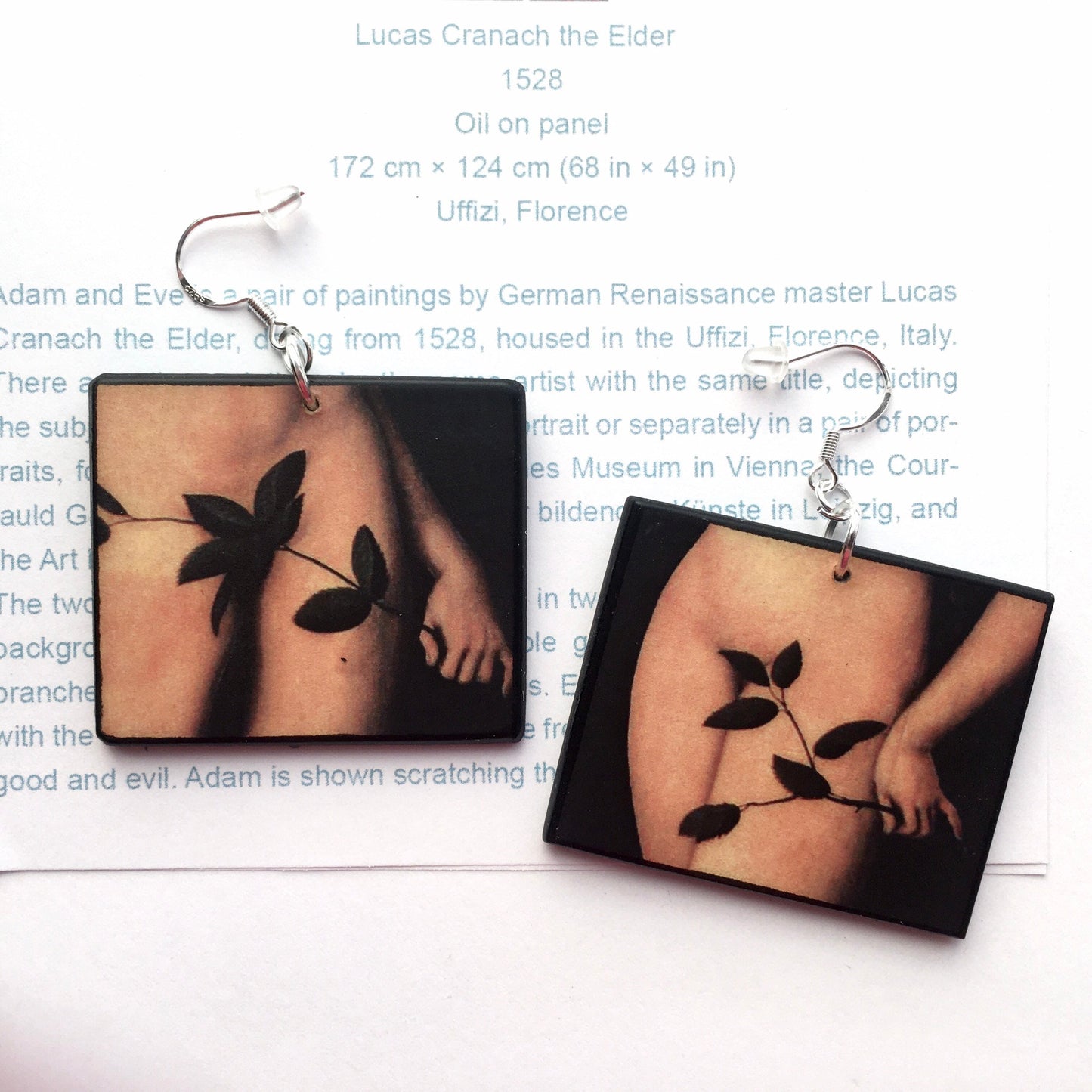 Lucas Cranach, Adam and Eve, mismatched earrings. Detail of the leaf in front of the nude body. The arrings are made with sostainable wood by Obljewellery.