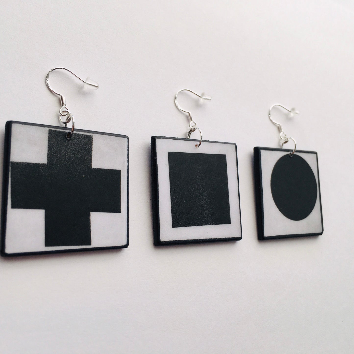 Geometric, abstract, statement art earrings inspired Obljewellery by Kazimir Malevich and his paintings in Suprematism style. Black Cross, Black Circle and Black Square