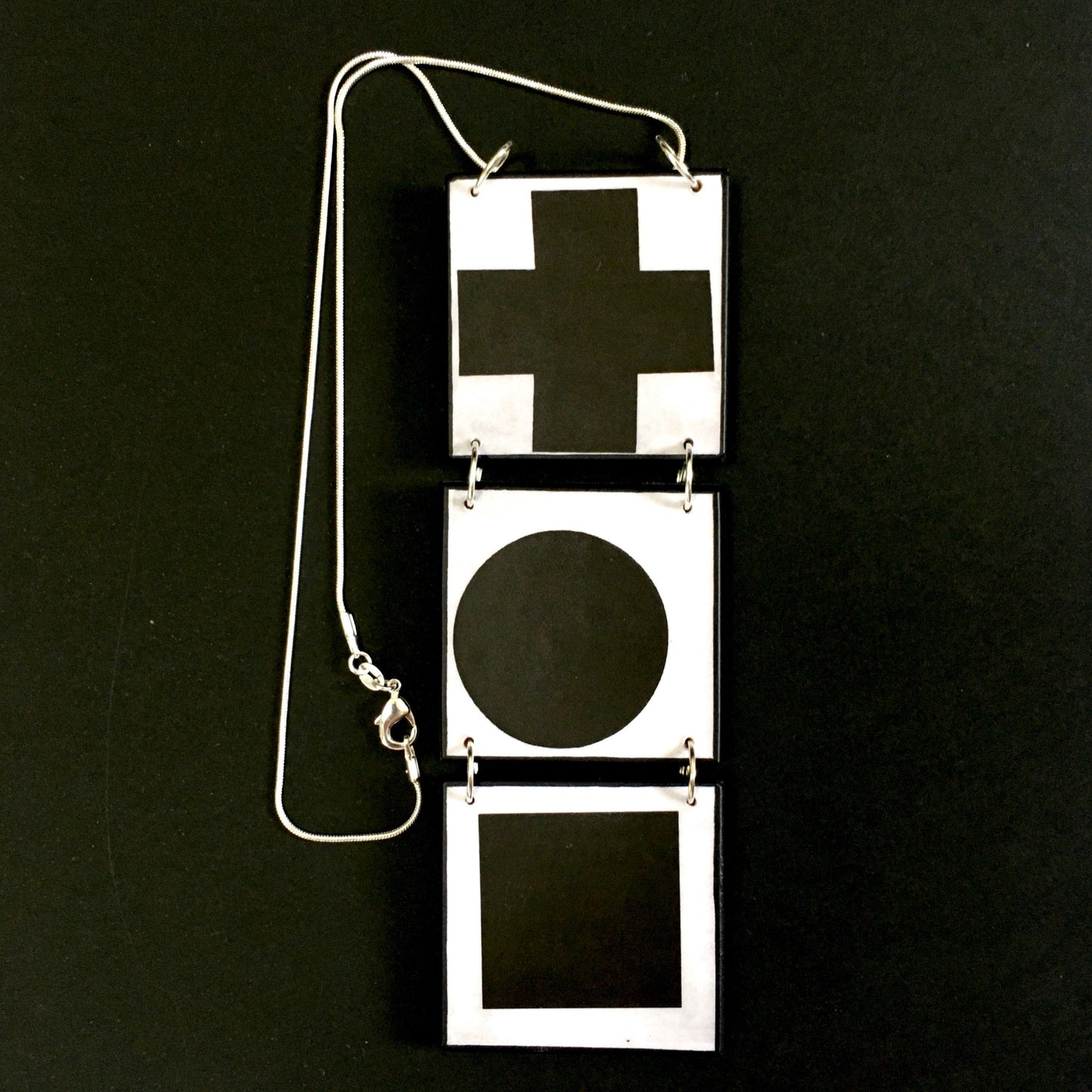 Geometric, abstract, statement art necklace inspired Obljewellery by Kazimir Malevich and his paintings in Suprematism style.