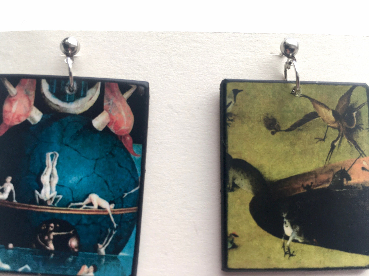 Hieronymus Bosch, art details, stud earrings on sustainable wood. Mismatched earrings blue and green with fantasy scene with animals. Sustainable gift for her.