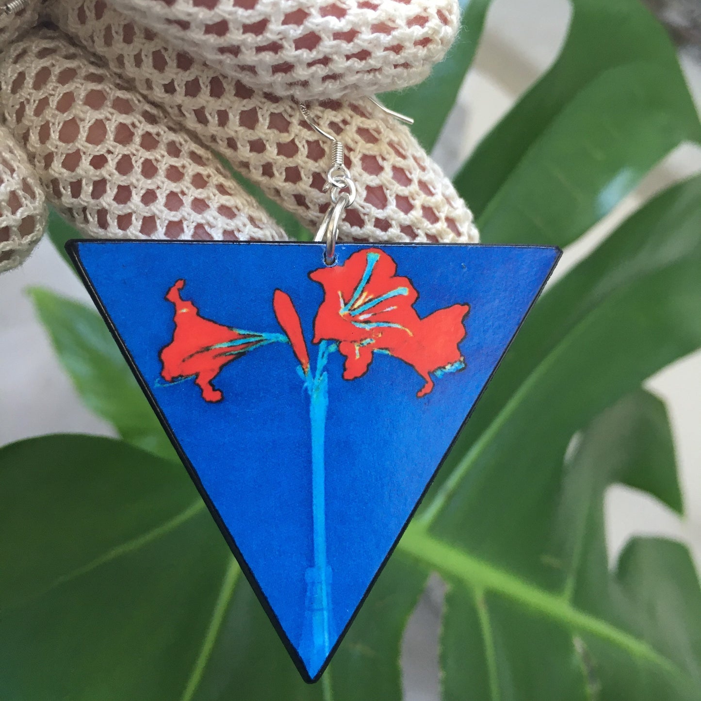 Triangle earrings with an art detail of Mondrian painting. Red flowers and blue color. Sustainable handmade earrings on wood by Obljewellery.