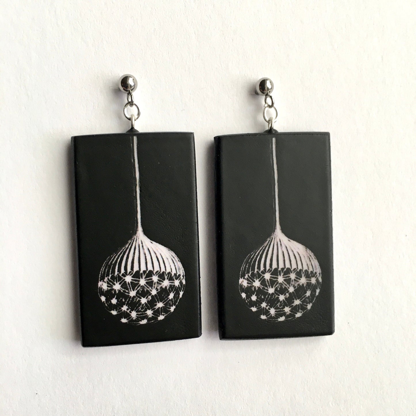 Earrings on wood inspired by Ernst Haeckel illustration
