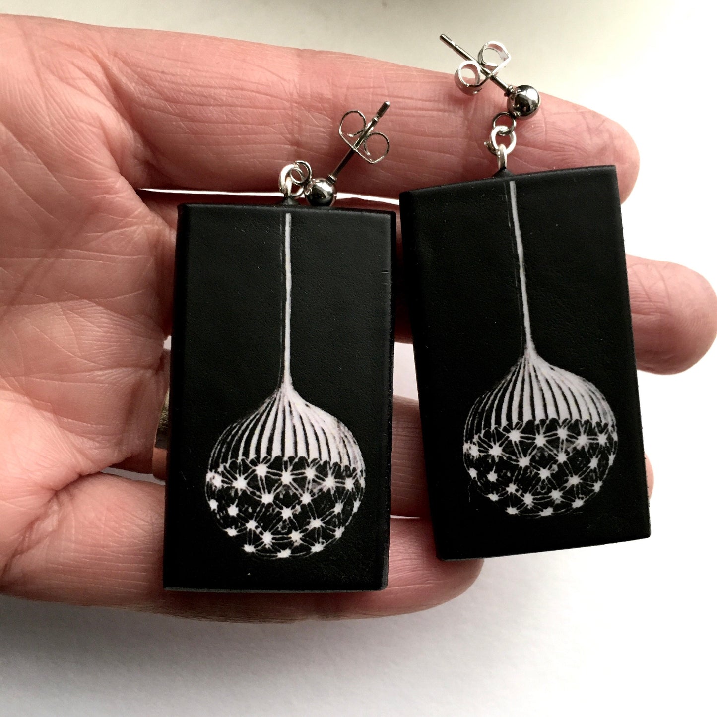 Earrings on wood inspired by Ernst Haeckel illustration