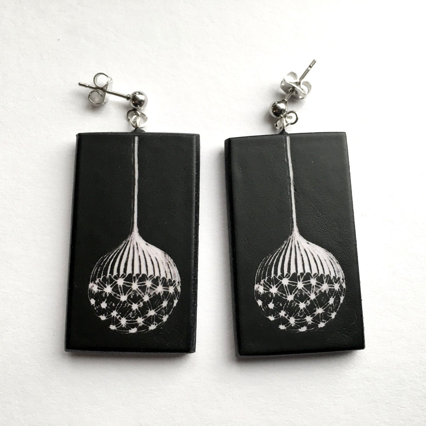 Earrings on wood inspired by Ernst Haeckel illustration