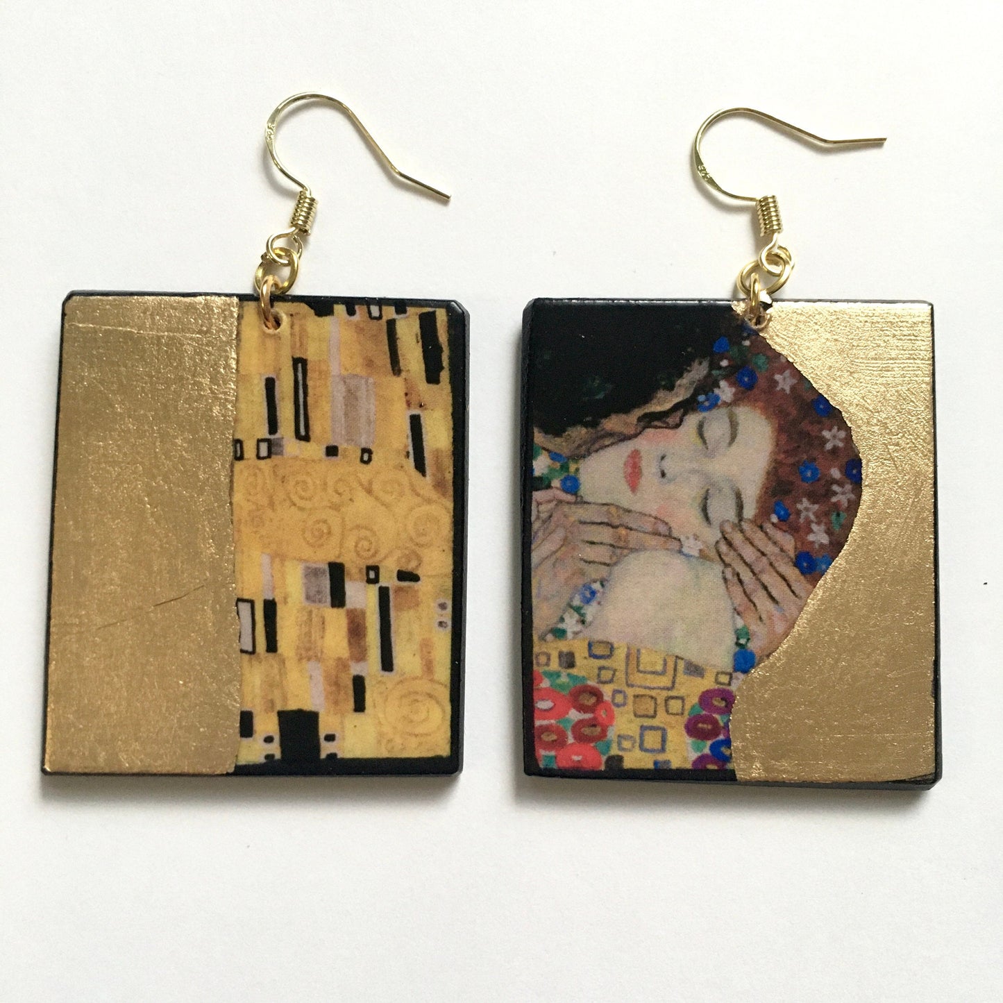 Gustav Klimt, The Kiss painting inspired the Obljewellery shop to create these earrings on rectangular wood with a gold leaf detail.