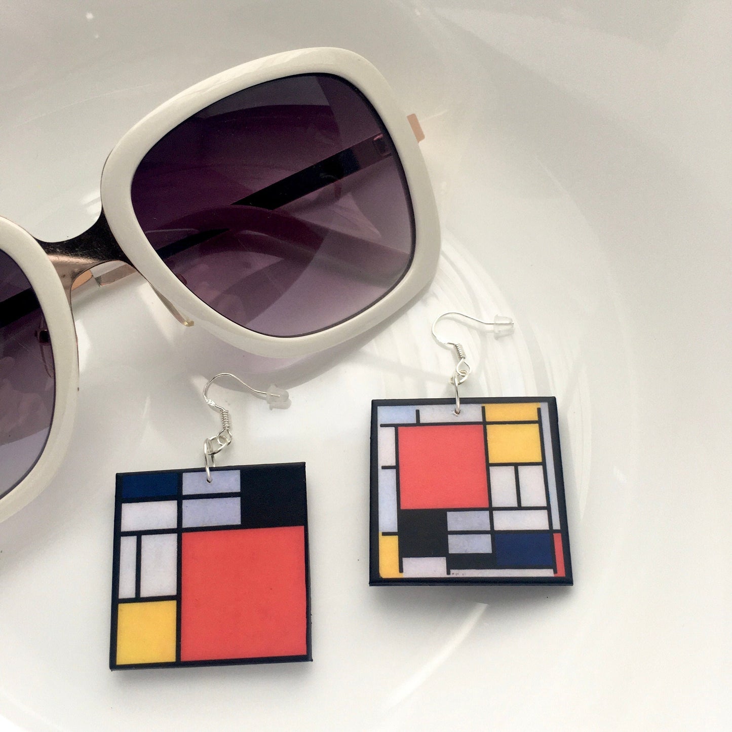 Mismatched earrings inspired by Mondrian.