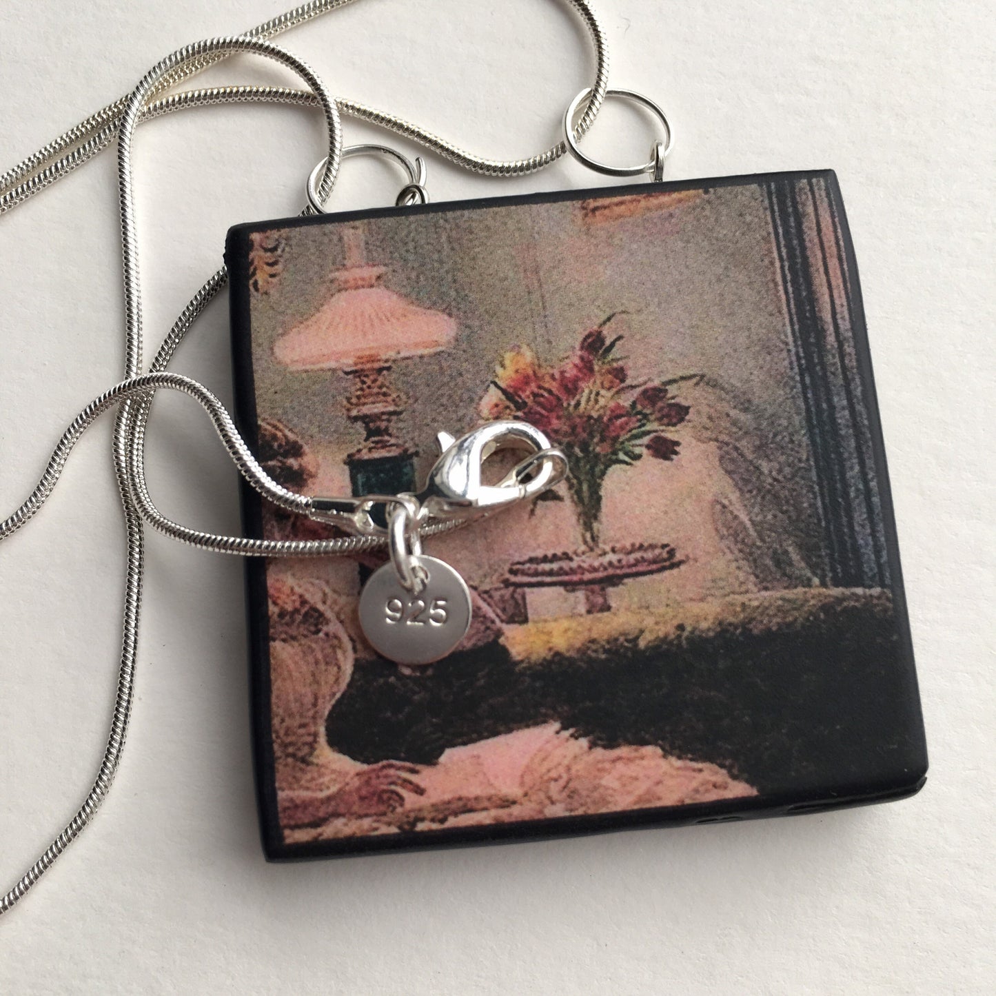Victorian art detail painting “An Evening at Home” 1888. by Edward John Poynter on this sustainable, statement, wood pendant with sterling silver necklace, handmade by Obljewellery, artsy and aesthetic gift shop.