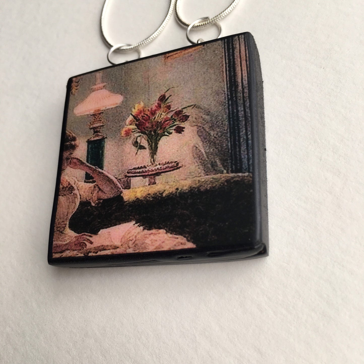 Victorian art detail painting “An Evening at Home” 1888. by Edward John Poynter on this sustainable, statement, wood pendant with sterling silver necklace, handmade by Obljewellery, artsy and aesthetic gift shop.
