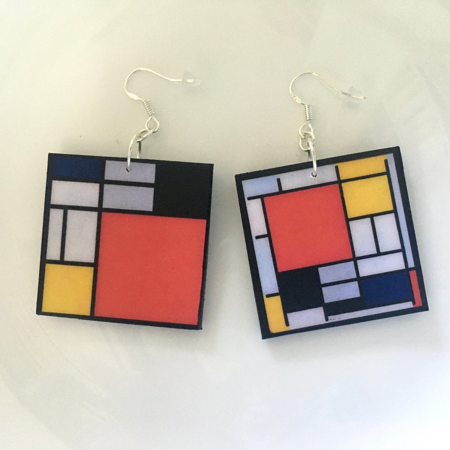 Mismatched earrings inspired by Mondrian.