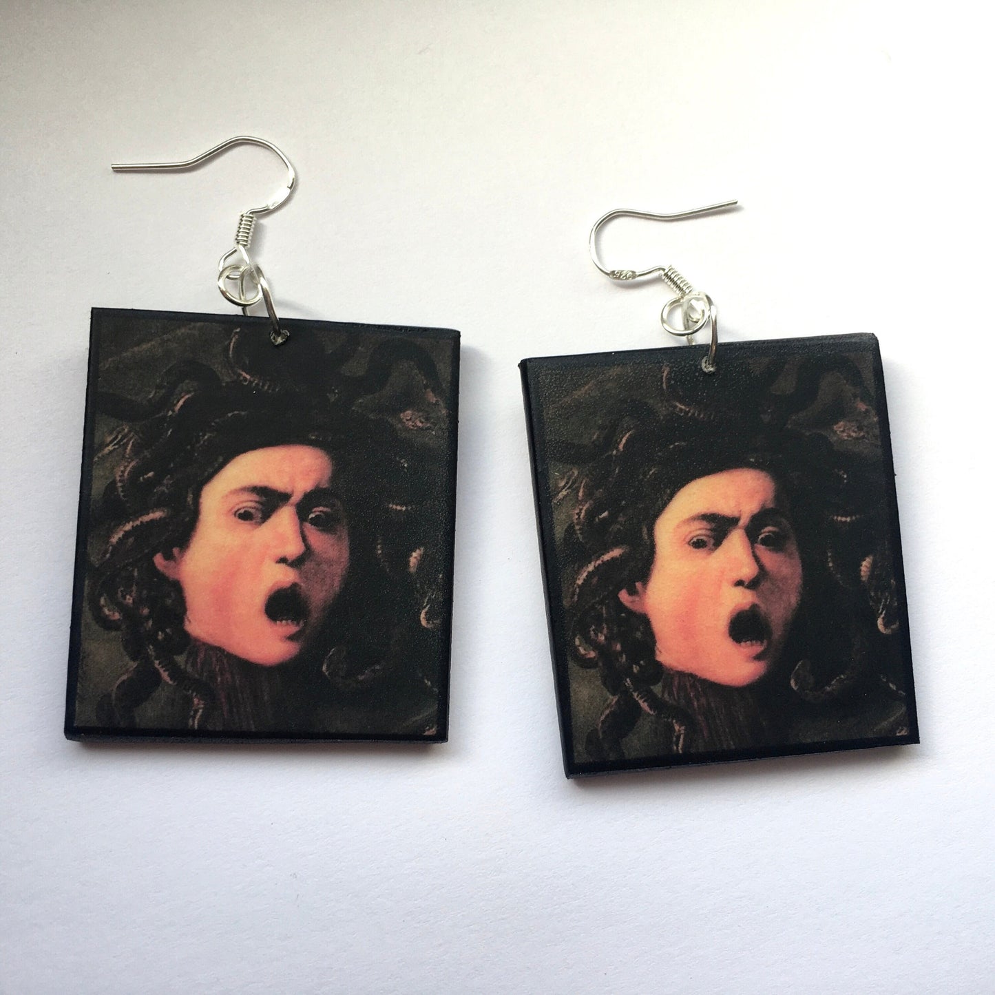 Medusa art earrings, impressive painting by Italian artist Caravaggio (Michelangelo Merisi). Lightweight wood, gothic style earrings with sterling silver hooks, completely handmade by obljewellery