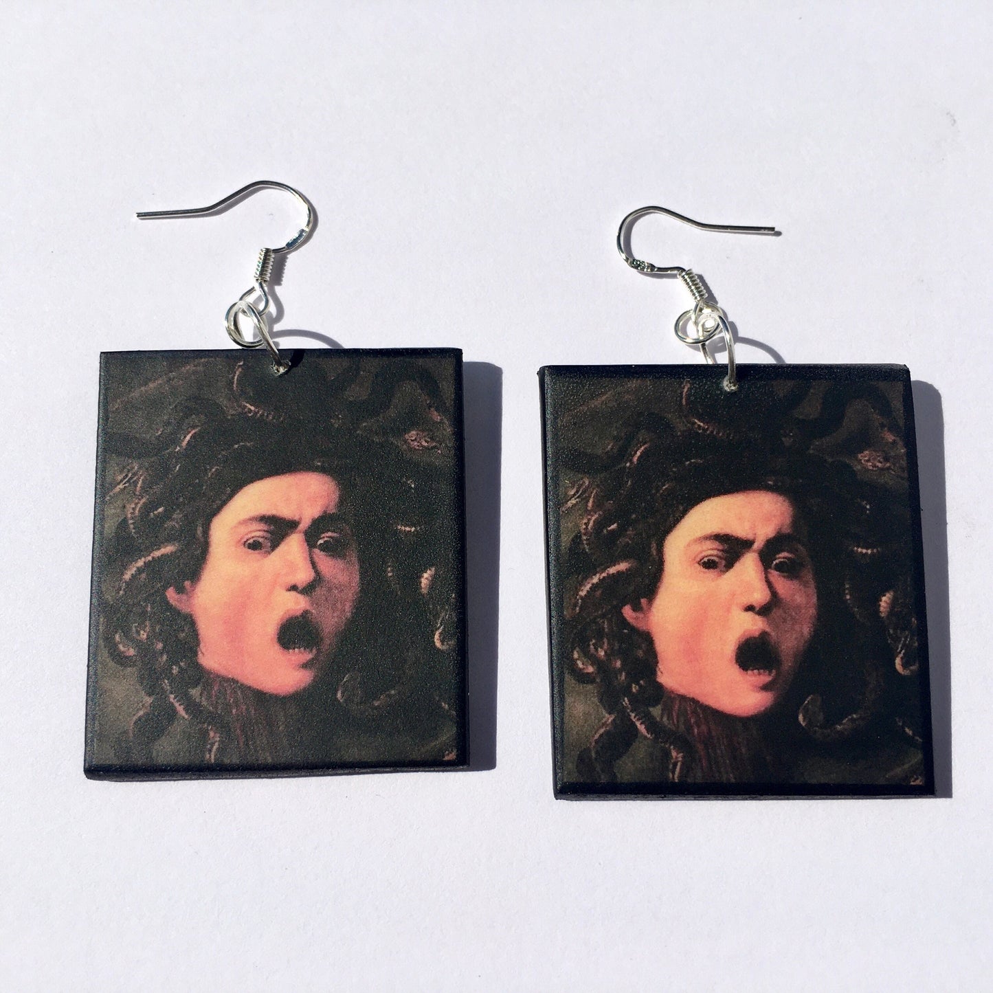 Medusa art earrings, impressive painting by Italian artist Caravaggio (Michelangelo Merisi). Lightweight wood, gothic style earrings with sterling silver hooks, completely handmade by obljewellery