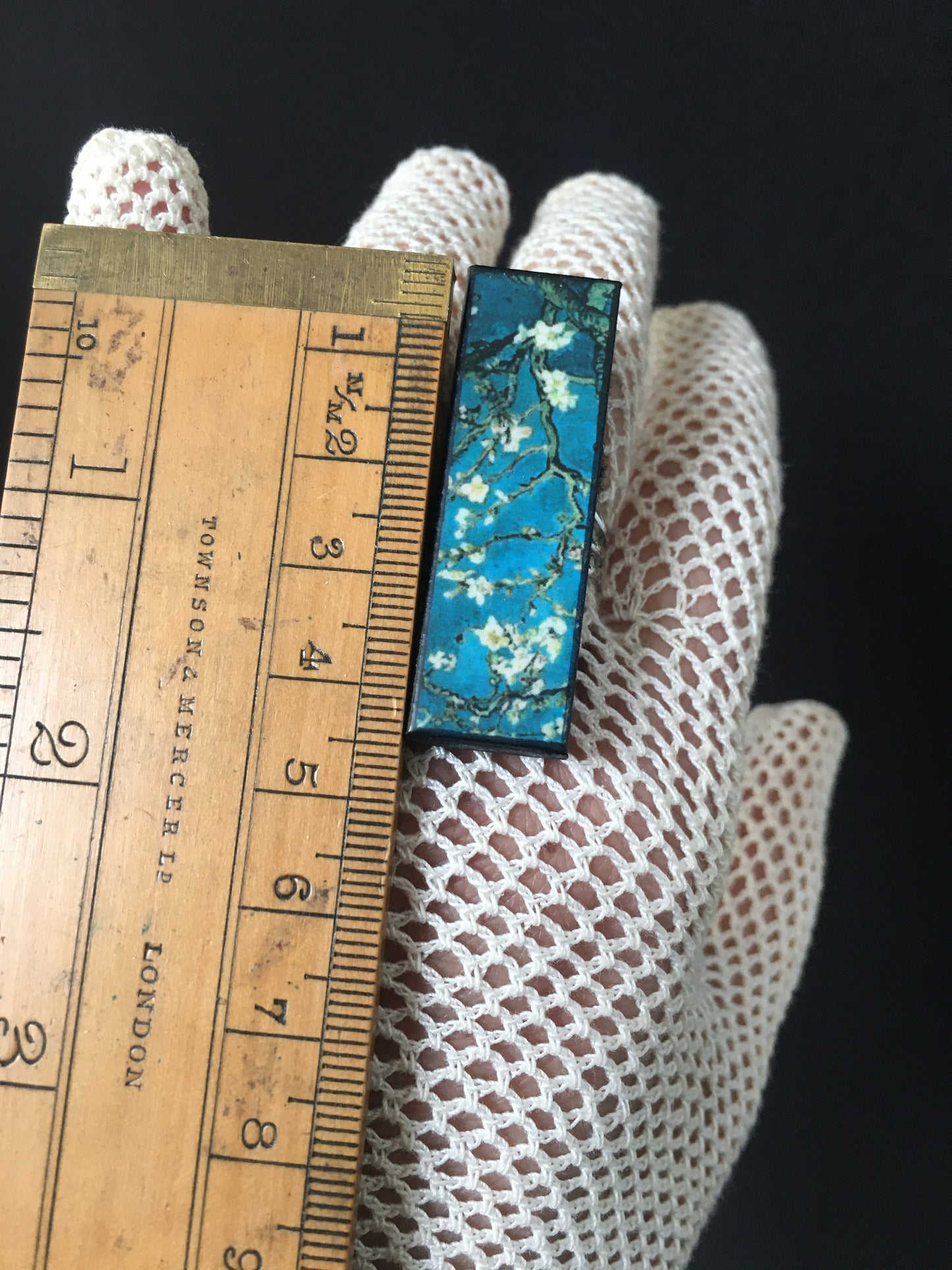 Inspired by the Van Gogh painting Almond Blossom, Obljewellery handmade from sustainable wood this rectangular ring with adjustable silver colour band ring. White flowers against turquoise sky.