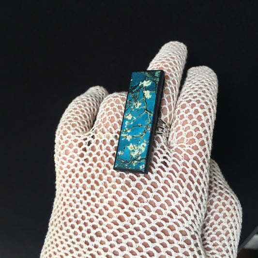 Inspired by the Van Gogh painting Almond Blossom, Obljewellery handmade from sustainable wood this rectangular ring with adjustable silver colour band ring. White flowers against turquoise sky.