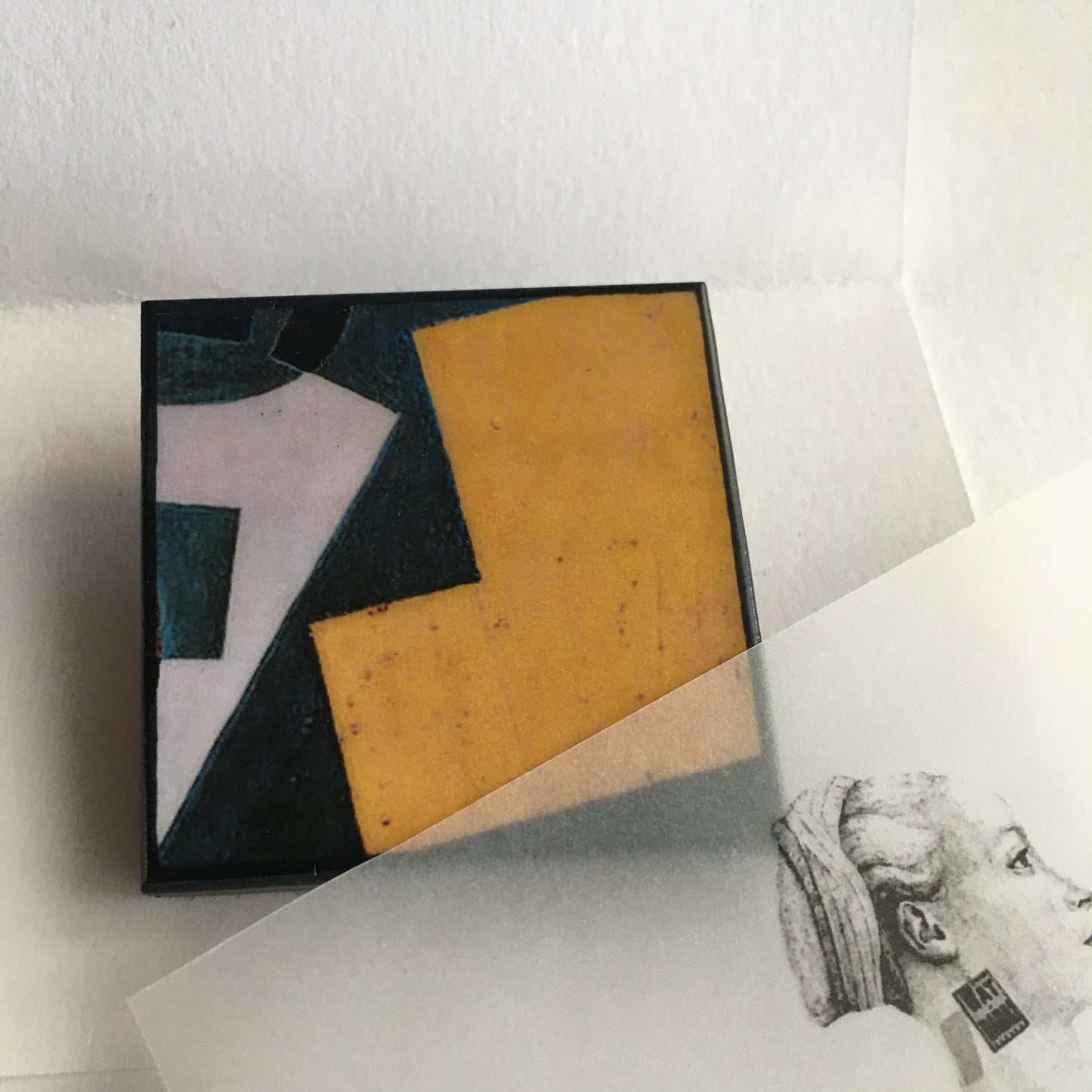 Art detail from Cubism painting by Spanish artist Juan Gris. Sustainable square brooch handmade from wood by Obljewellery