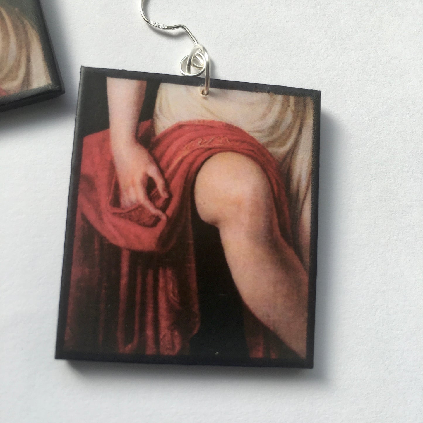 Sappho art, mismatched earrings