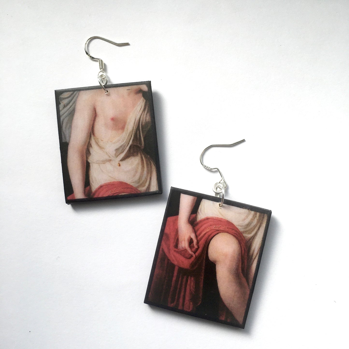Sappho art, mismatched earrings