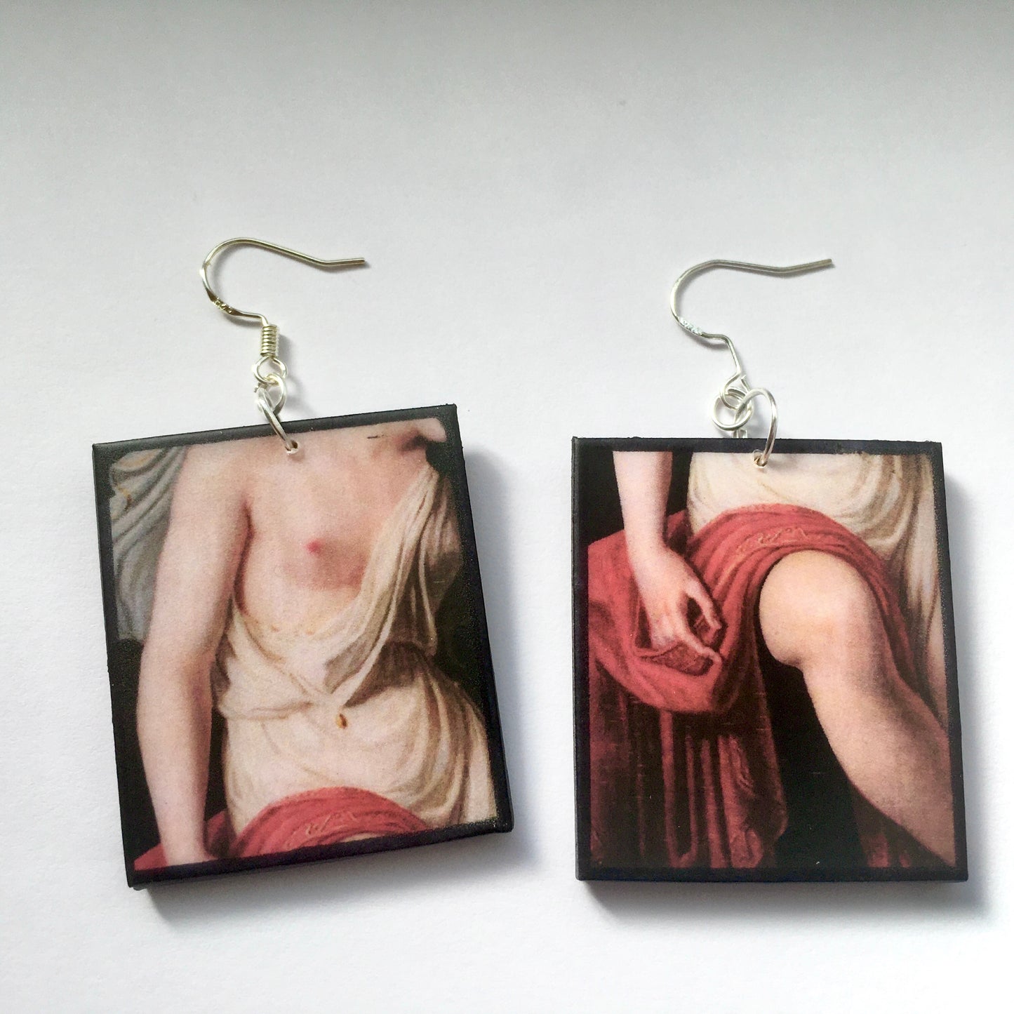 Sappho art, mismatched earrings