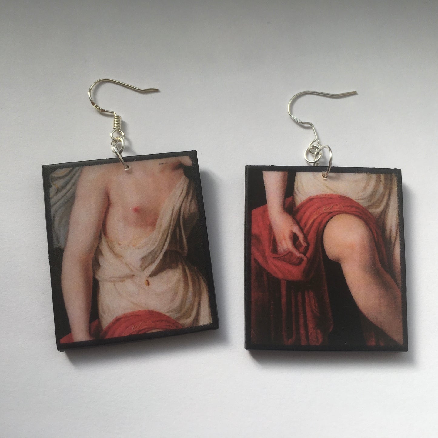 Sappho art, mismatched earrings